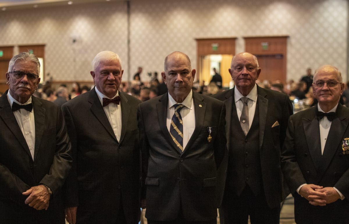 From left to right: Henry “Hank” Fletcher, Joe McLenigan, John J. Lord, Robert Evans, and Jerry Walker. All were present the day of the battle, and served under 1st Sgt. Lord. Photo by Jacob Granneman