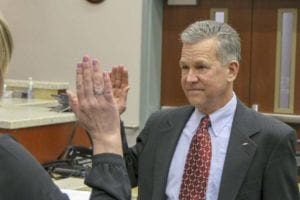 Clark County Council Clerk Rebecca Messinger delivers the oath of office to Gary Medvigy, who was selected to fill the vacant District 4 seat. Photo by Chris Brown