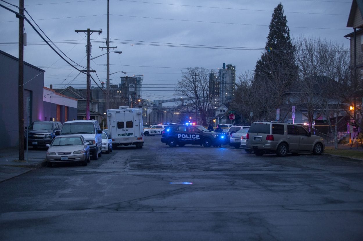 Members of the Regional Major Crimes Team talk on the scene of a deadly officer-involved shooting Thursday in Vancouver. Photo by Johnny Driver