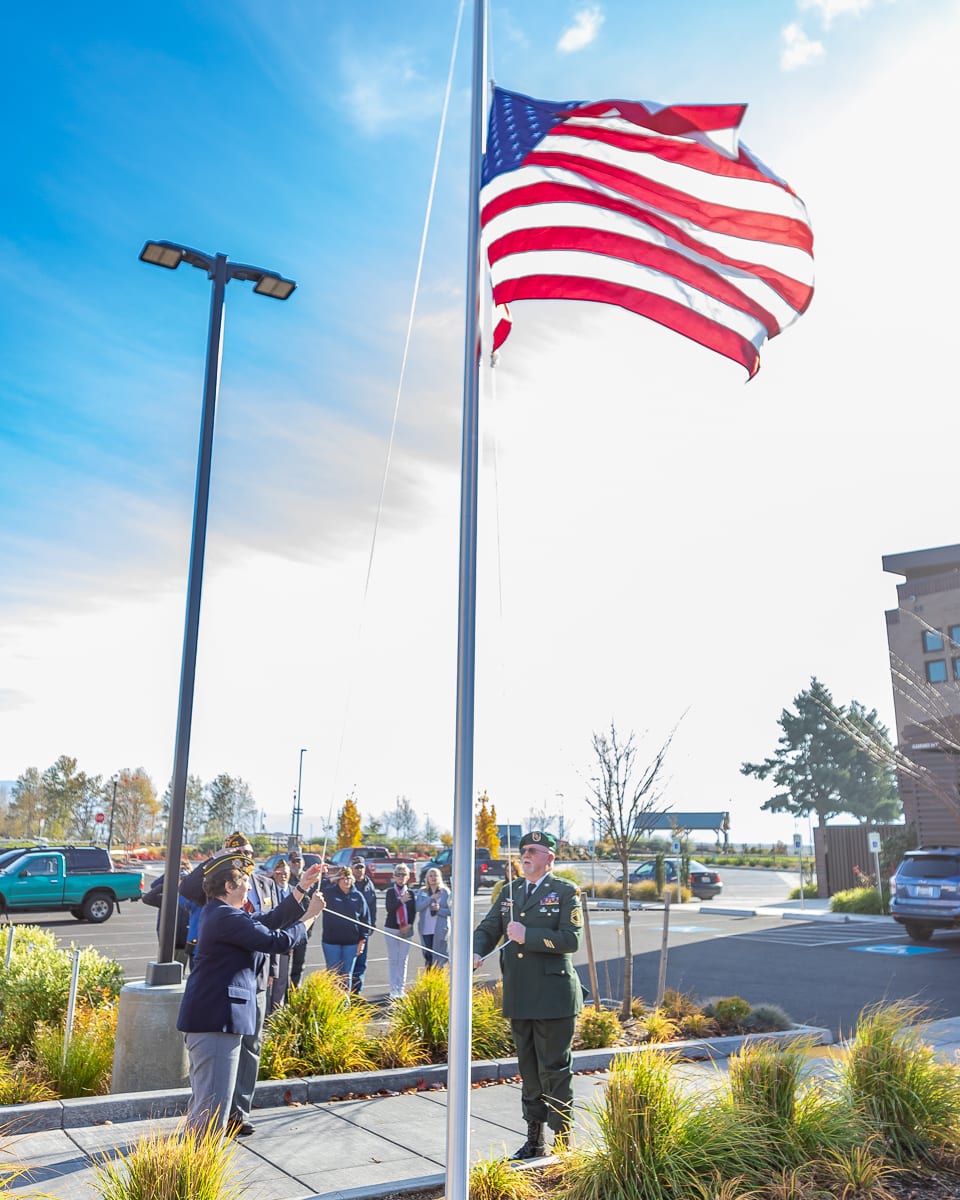  The newly dedicated flag pole at The Black Pearl on the Columbia is hoisted to full mast on Veterans Day 2019. Photo by Mike Schultz