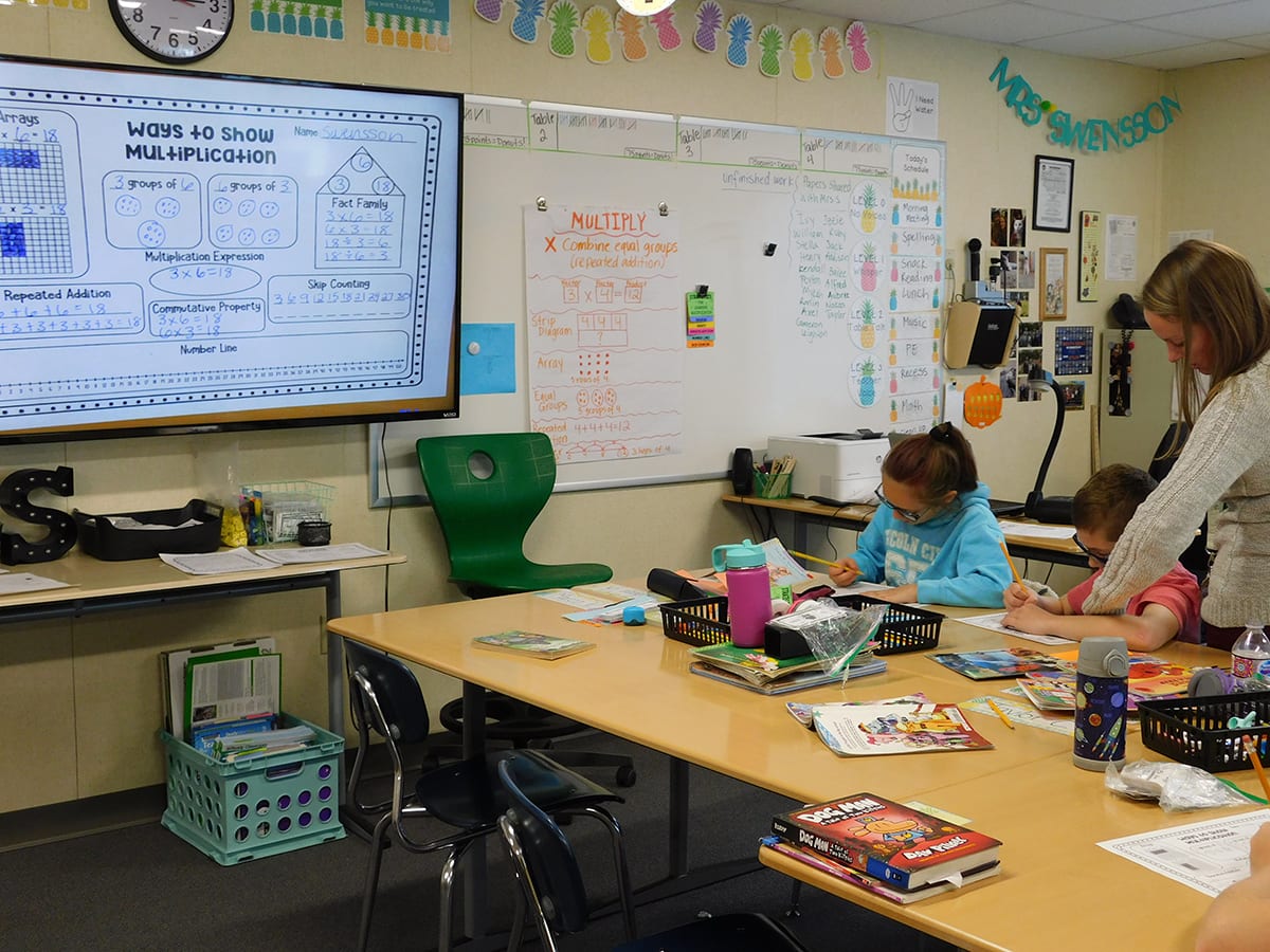 At her co-teaching station, South Ridge Elementary School teacher, Megan Suarez works with a group of students using colored squares to visualize multiplication. Photo courtesy of Ridgefield Public Schools