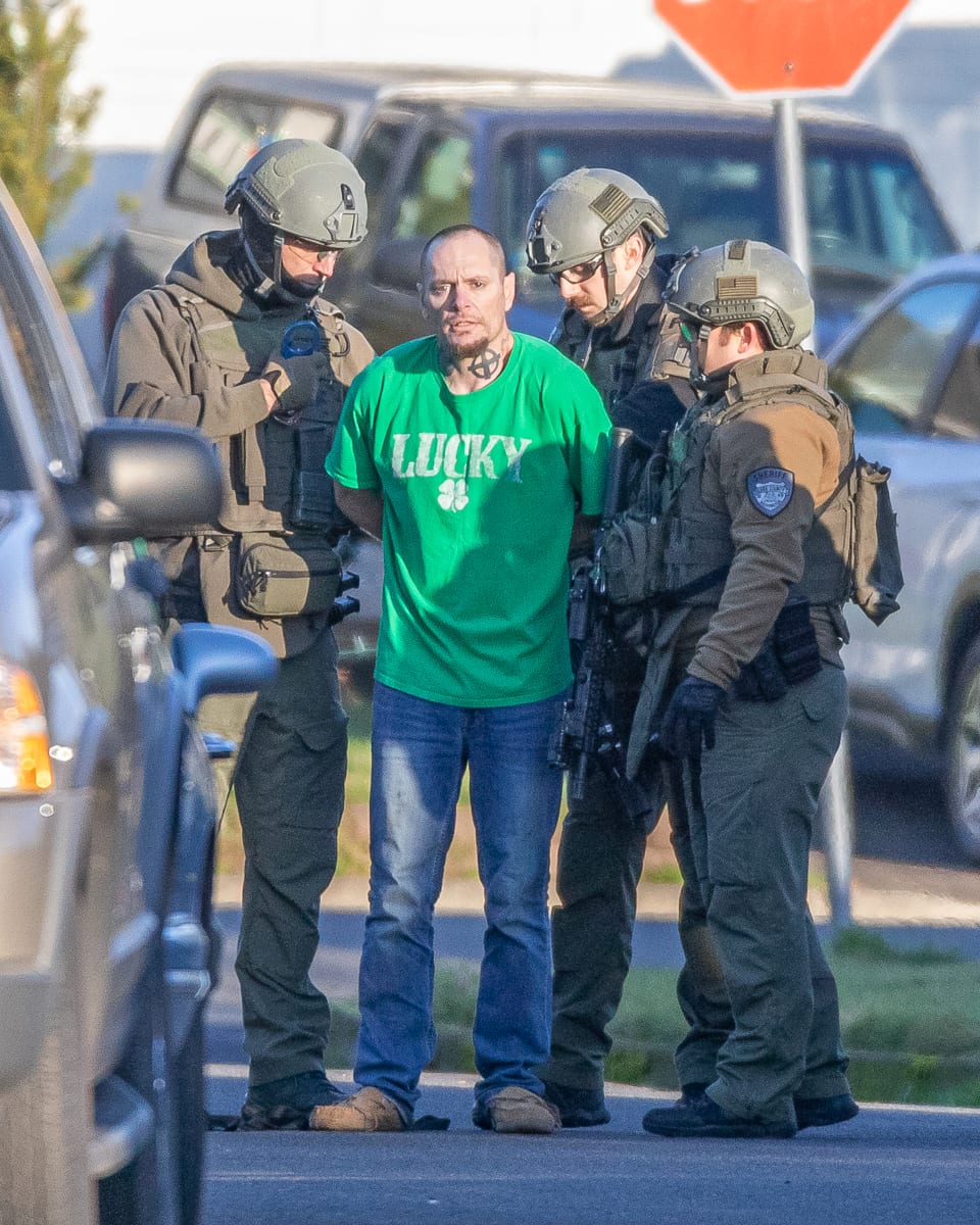 Lynn Cargile is taken into custody after a standoff with SWAT team members.