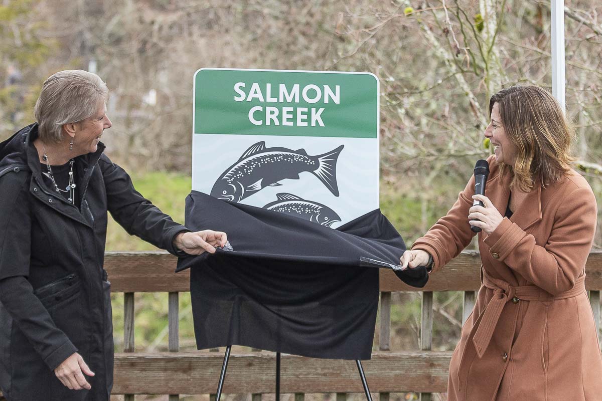New watershed signs were unveiled Friday in a ceremony at Klineline Pond featuring Councilor Julie Olson (left) and Temple Lentz (right). Photo by Mike Schultz