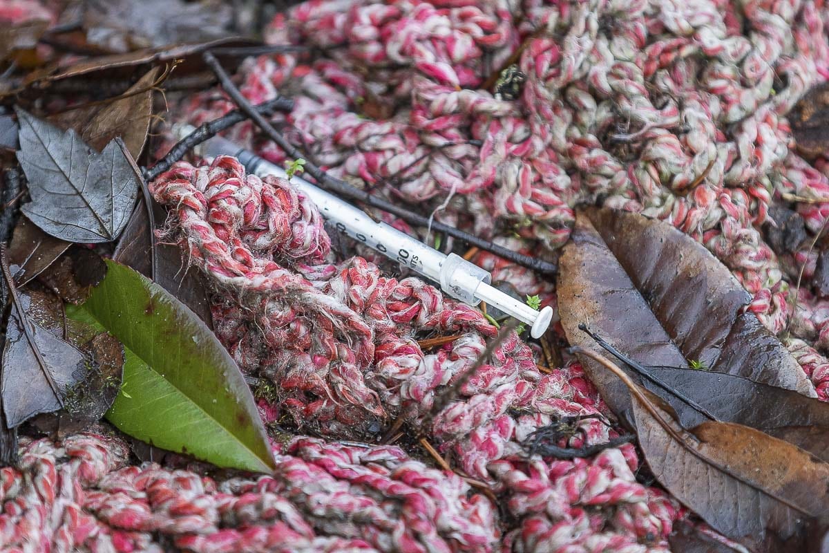 A used drug needle at a homeless encampment along Columbia Way in Vancouver. Photo by Mike Schultz