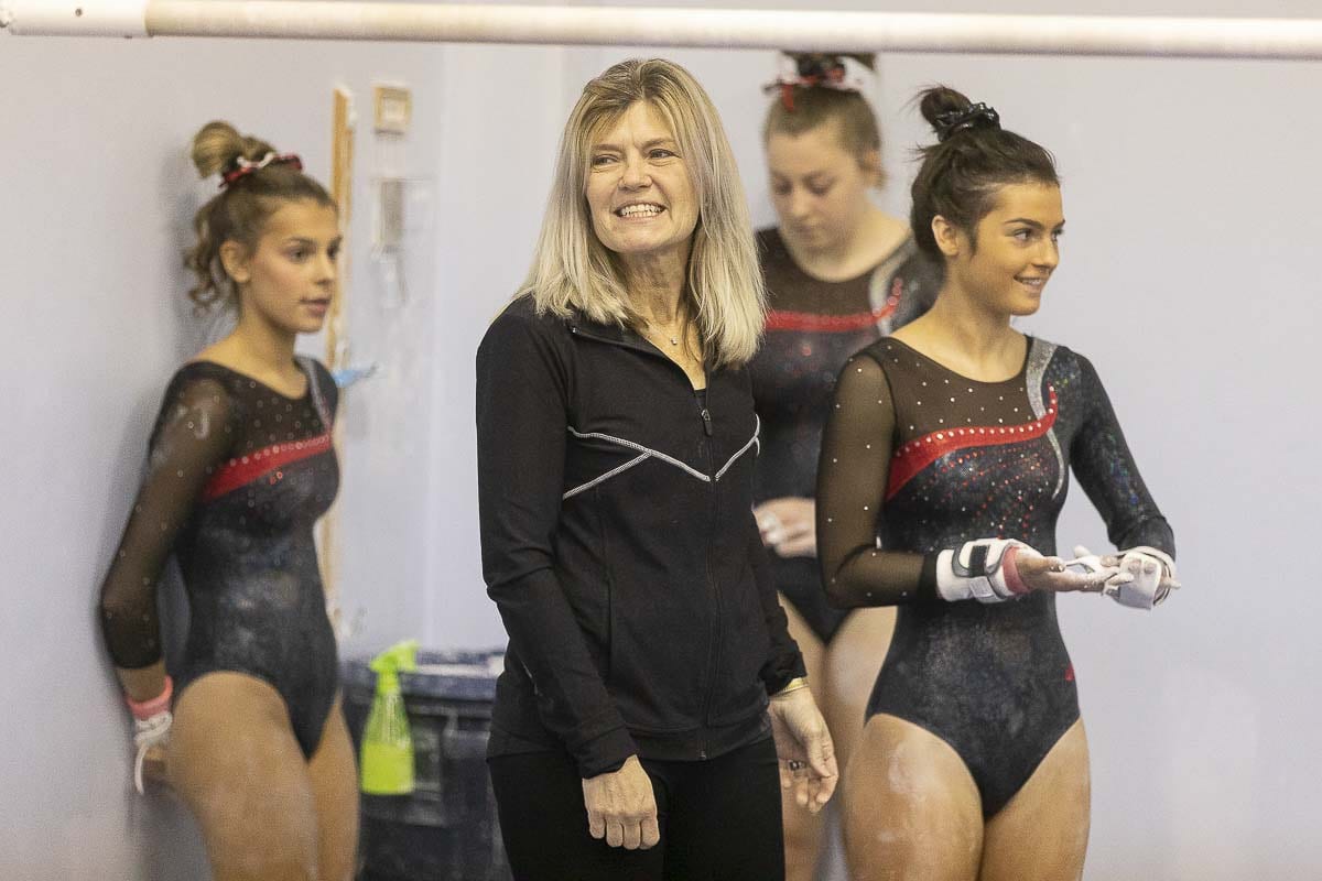 Camas gymnastics coach Carol Willson is so much more than a two-time state champion coach. She also works in international travel, and helps children in need. Photo by Mike Schultz