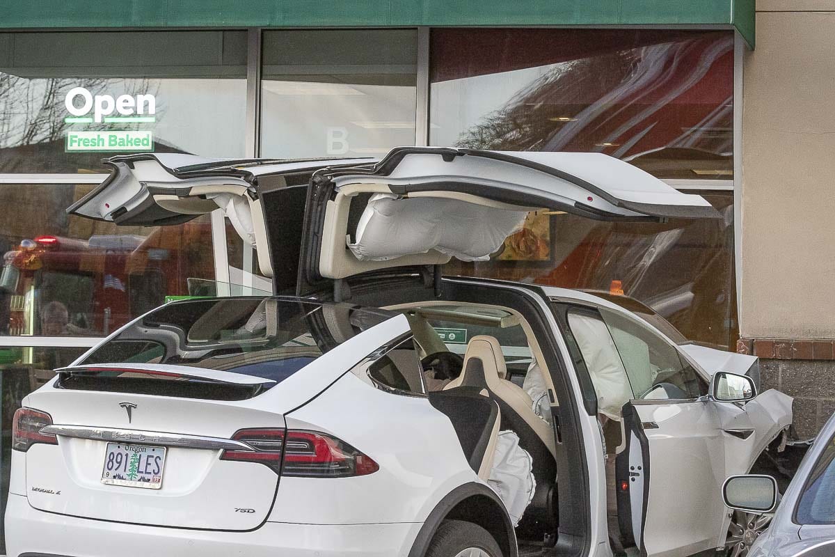 One passenger inside a Tesla that crashed into a Woodland Subway restaurant had minor injuries on Sunday afternoon. Photo by Mike Schultz