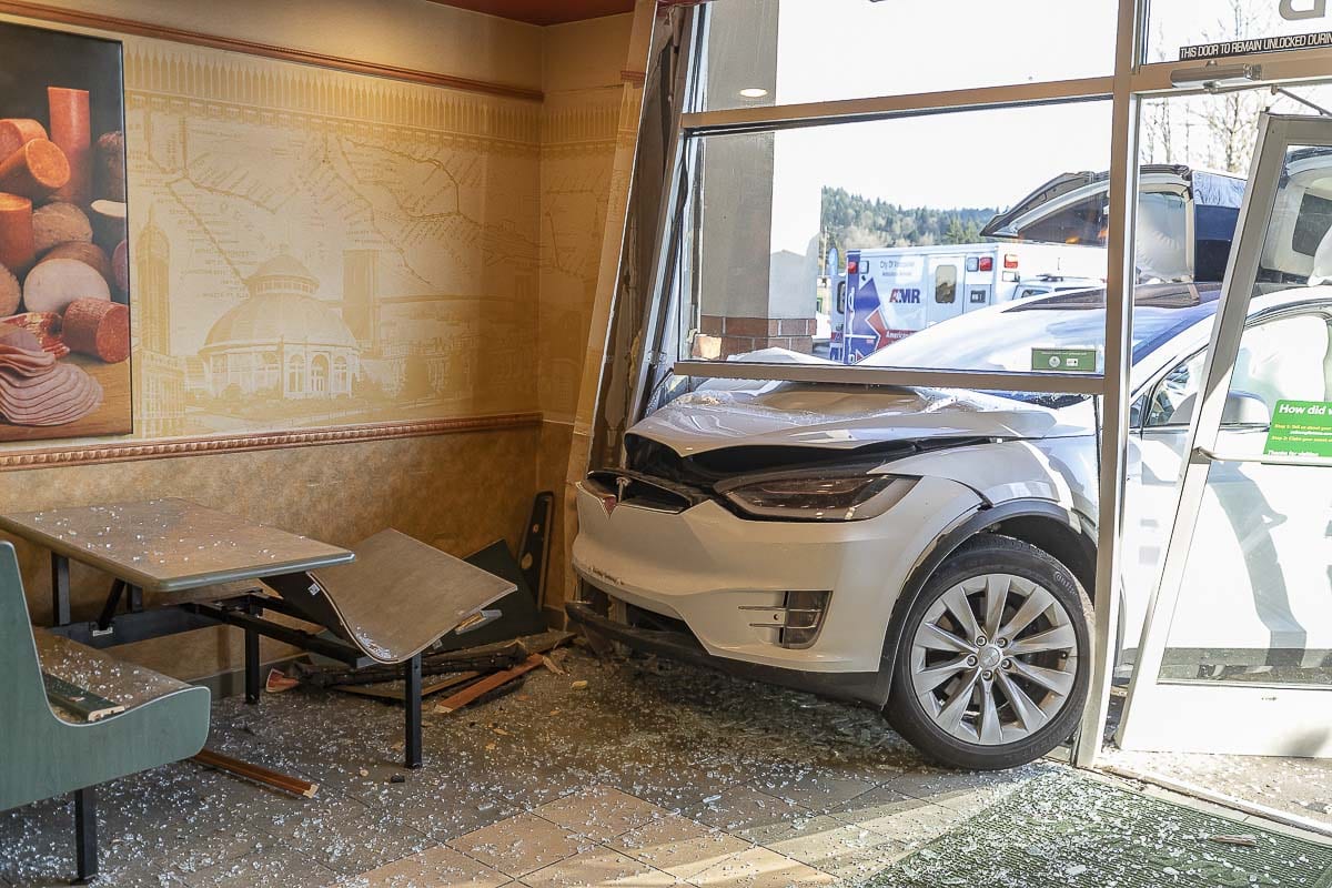 A Tesla plowed into the front window of a Subway restaurant in Woodland on Sunday. No one inside the restaurant was injured. Photo by Mike Schultz