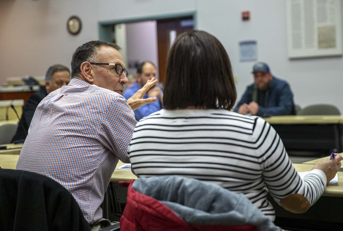 Chuck Rose (left) and Christy McDonough (right) of Cadman, speak to SMAC members about their proposed expansion at their Lewisville sand and gravel pit. Photo by Jacob Granneman