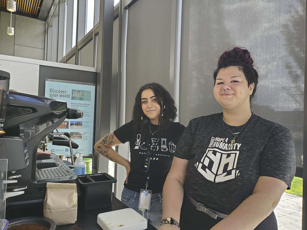 Project Hope 4 Humanity barista Billie Walters and graduating intern Khyra Ludwig, are seen here at work behind the coffee cart at the Vancouver Community Library. Photo courtesy of Paige Uhlemeyer