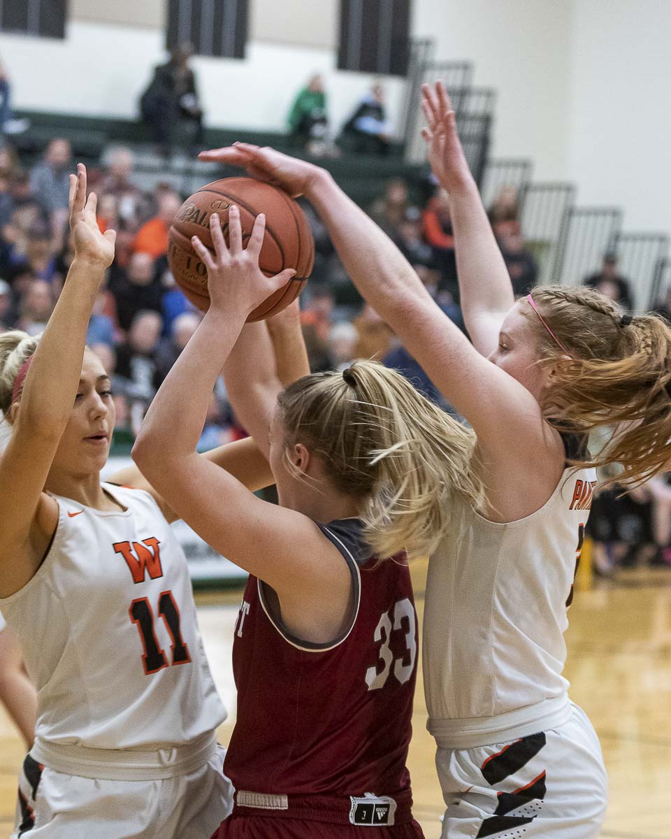Washougal’s McKinley Stotts (11) and Savea Mansfield provide the defensive pressure against W.F. West on Monday. Washougal’s defense was solid for most of the night but the offense struggled in a loss in the district semifinals. Photo by Mike Schultz