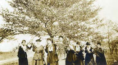 A women’s group is shown here wearing star banners. Photo courtesy of CCHM archives