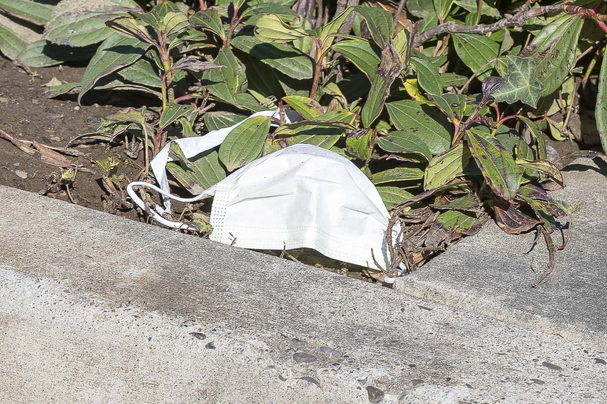 A valuable mask discarded along a sidewalk outside Legacy Salmon Creek Medical Center in Vancouver. Photo by Mike Schultz