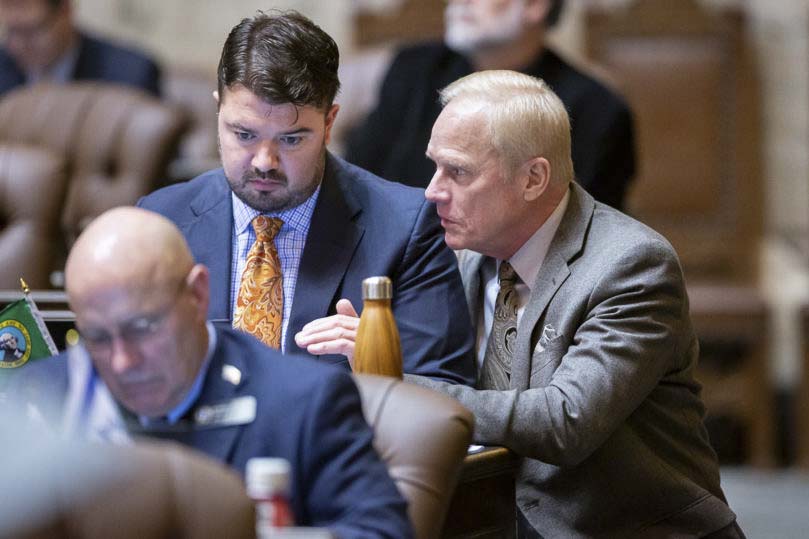 Rep. Paul Harris (right) consults with Rep. Brandon Bick (left) in this recent photo. Harris' bill that would enhance administration capabilities at Washington state charter schools has moved one step closer to becoming law Thursday. Photo courtesy of Washington State House Republican Communications