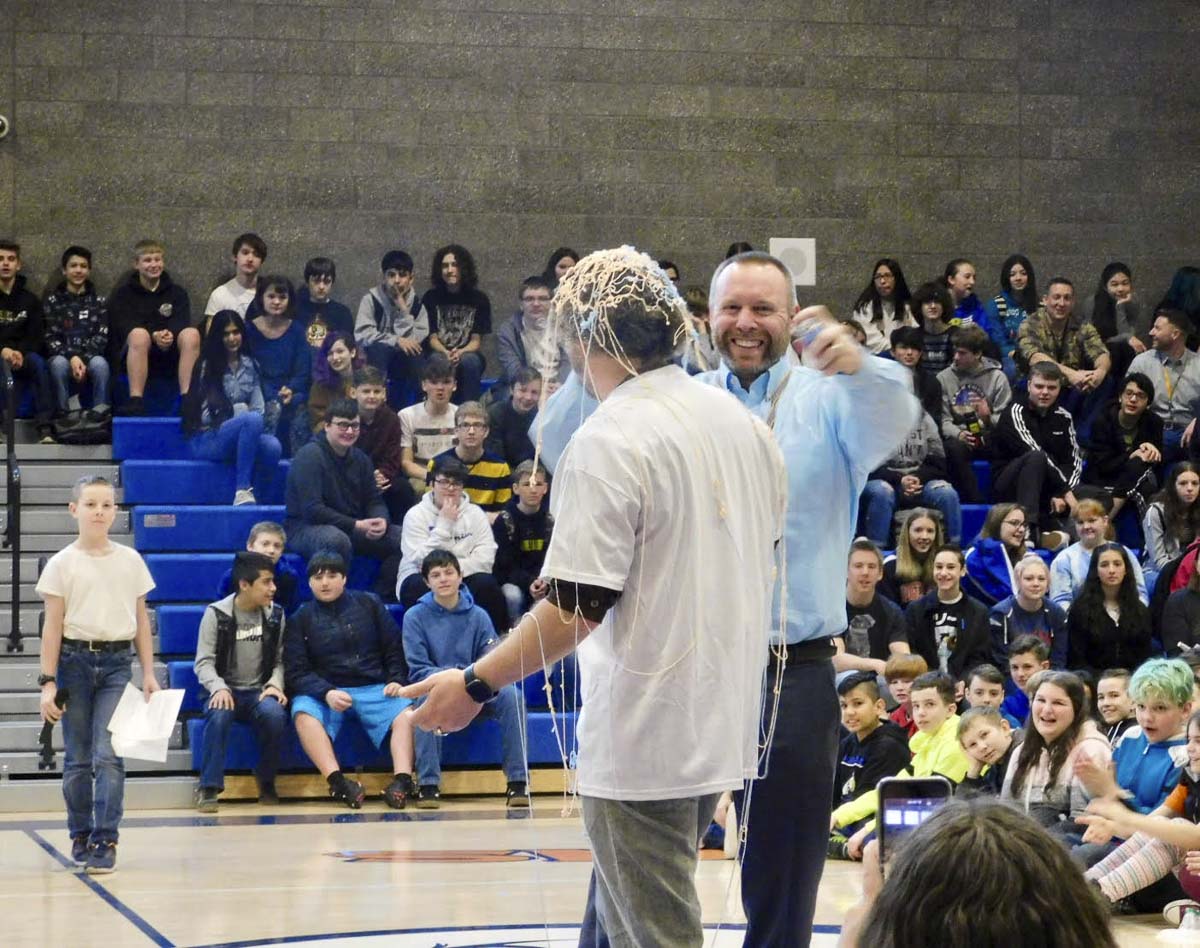 View Ridge Middle School principal Tony Smith covers Sunset Ridge Intermediate School principal Todd Graves in Silly String to celebrate View Ridge's success at Penny Wars. Photo courtesy of Ridgefield Public Schools