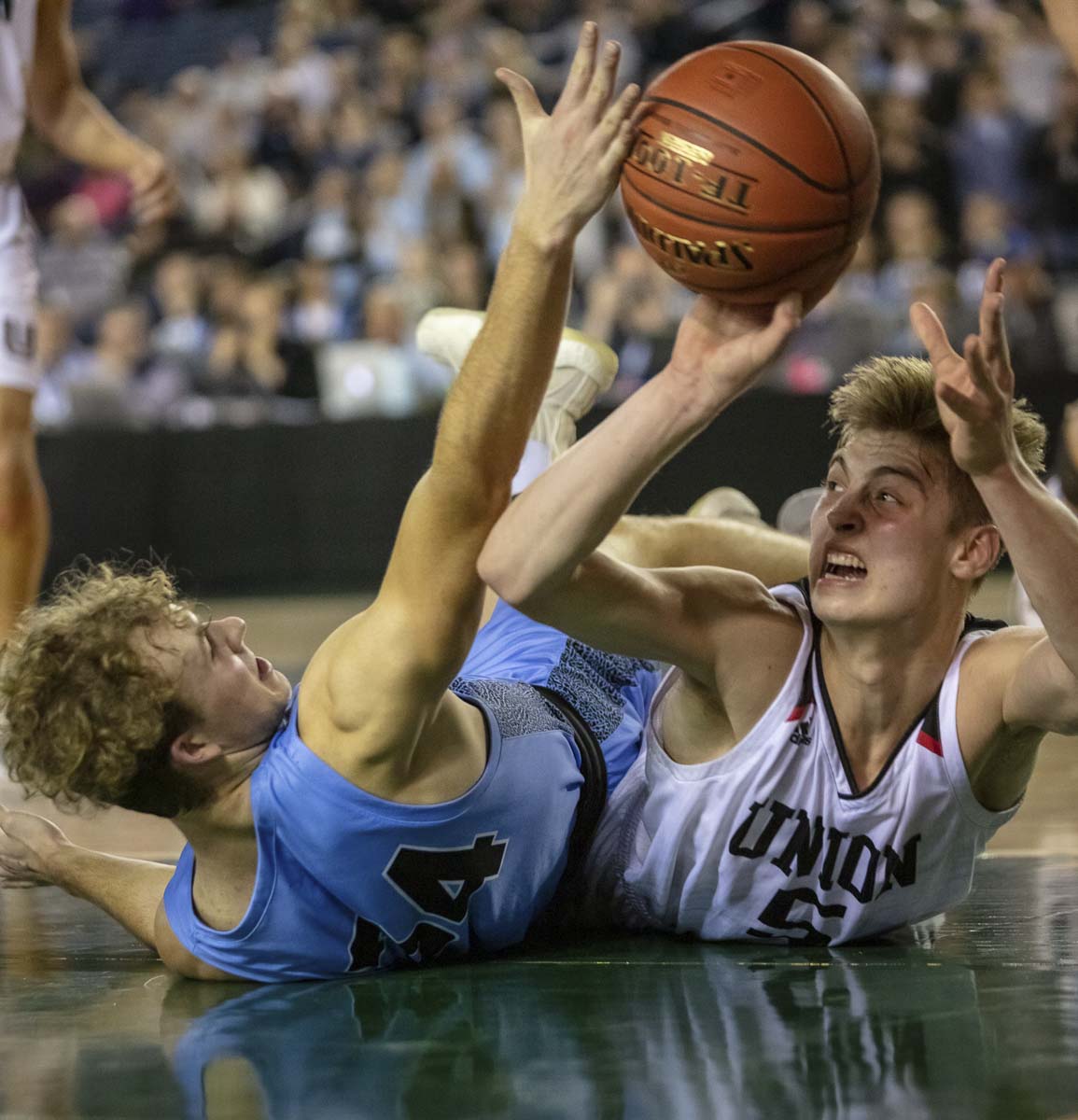 Union senior Tanner Toolson (right) battles for a loose ball Friday in the semifinals against Central Valley. Union suffered its first loss of the season. Photo courtesy Heather Tianen
