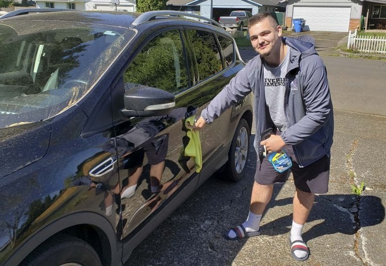 Heritage High School senior offers social distancing car wash