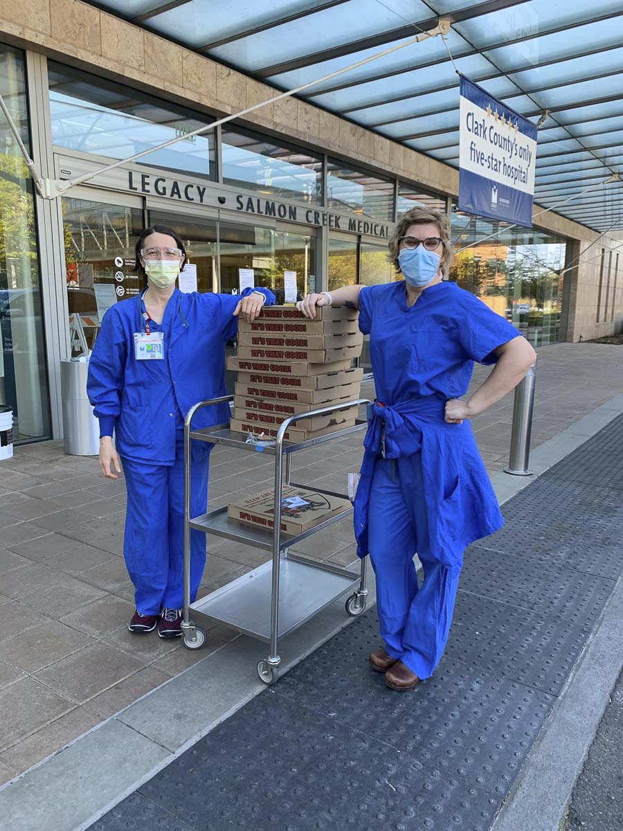 Nurses at Legacy Salmon Creek accept free pizza provided by Jevon Domench’s Academy Mortgage team and Detroit Pizza of Battle Ground. Photo courtesy Jevon Domench