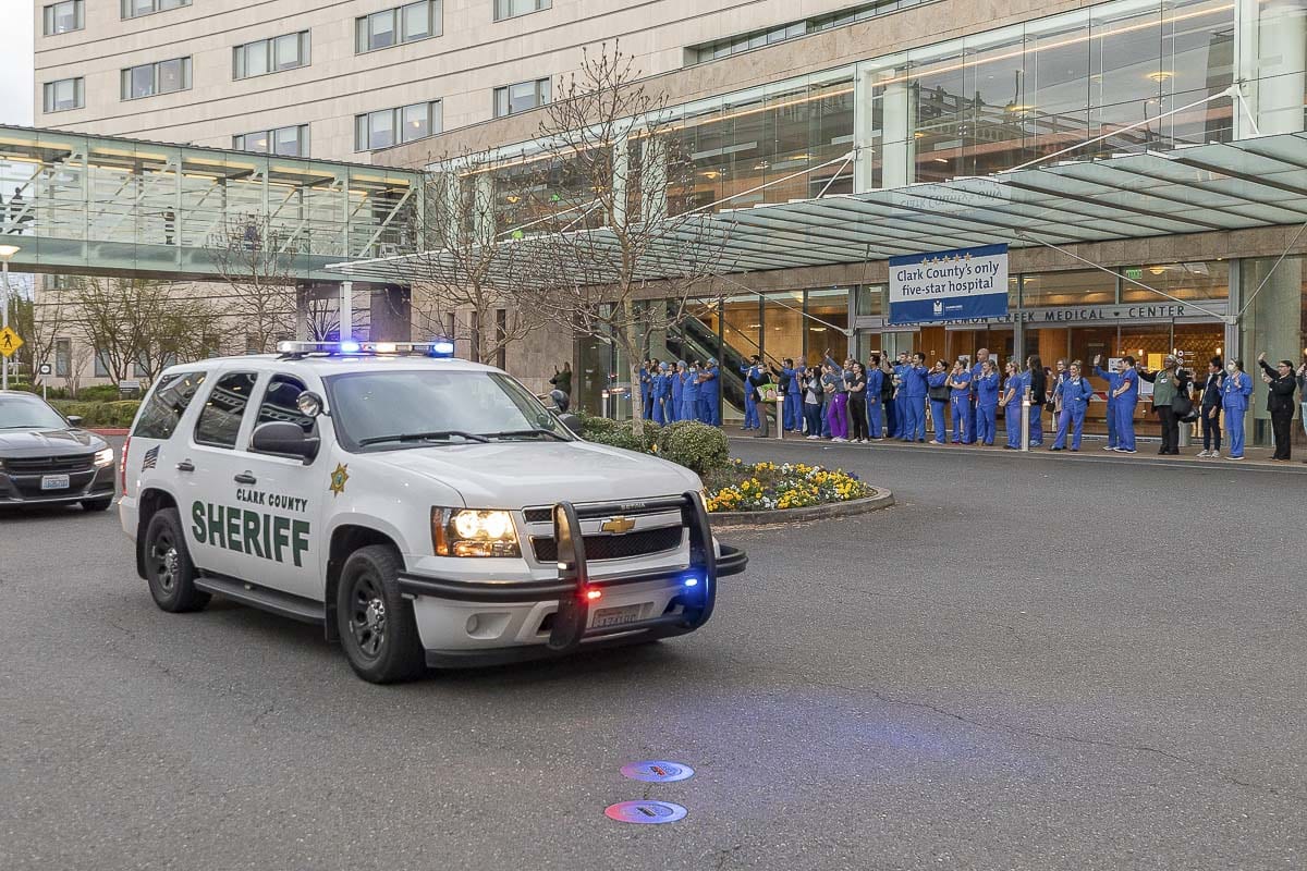 Kindness 911 partnered with area law enforcement agencies to honor healthcare workers at Legacy Salmon Creek Hospital Friday evening. Photo by Mike Schultz
