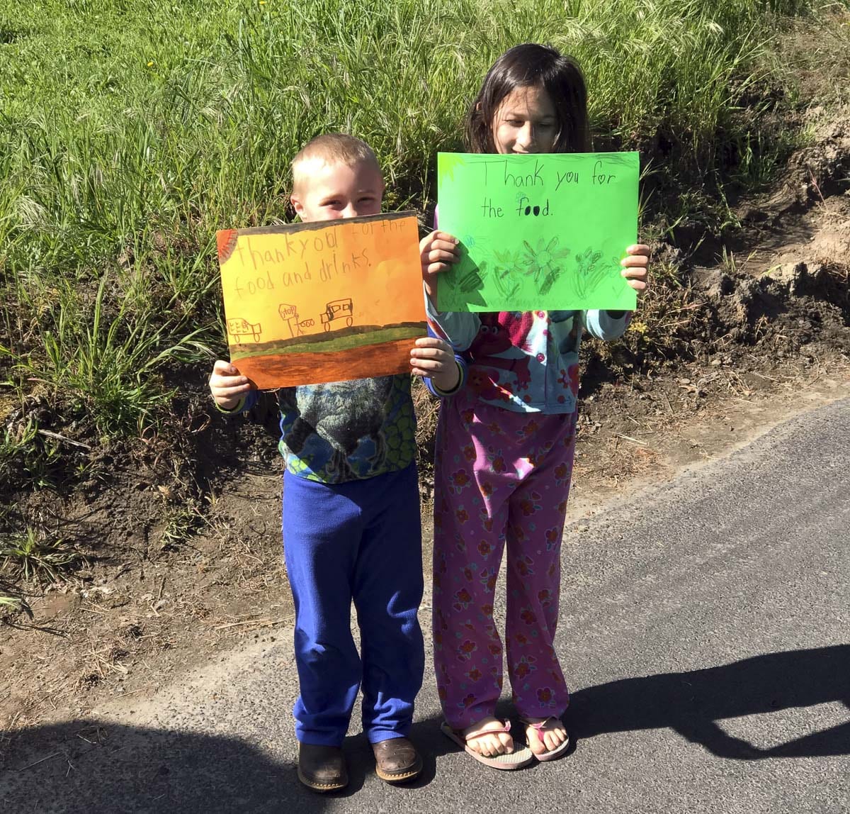 Students and their siblings made signs thanking Woodland Public Schools staff. Photo courtesy of Woodland Public Schools