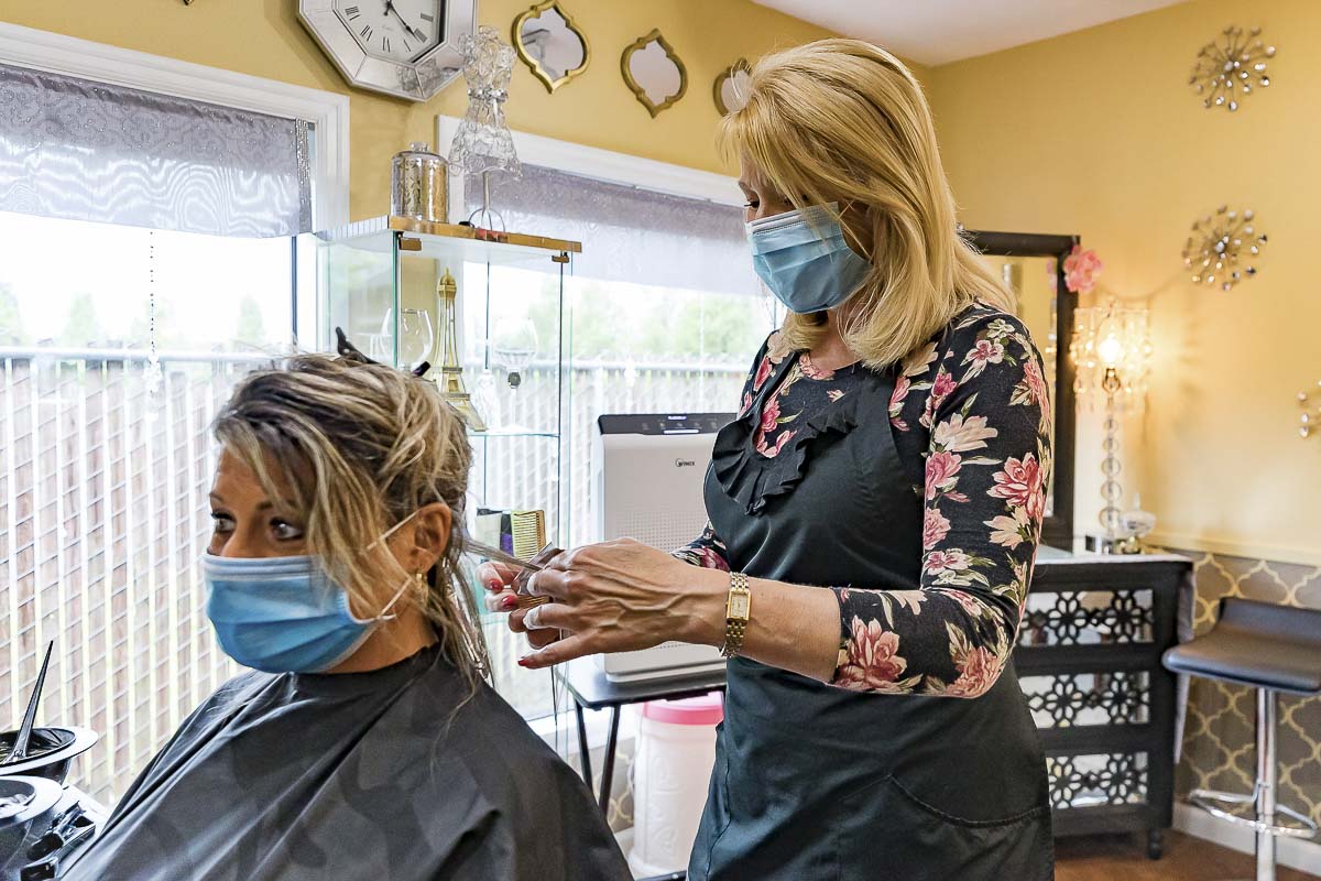 Vancouver hair stylist Betty Rae Wiant (right) is one of many area self-employed business professionals who were able to return to work after Clark County was allowed to enter Phase 2 of Washington’s Stay Safe reopening plan. Photo by Mike Schultz