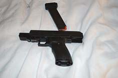 Detectives executed a search warrant at the suspect’s hotel room and located what appears to be a kidnappers kit which included heavy duty flex cuffs, handcuffs, duct tape, rubber gloves, face wrap/blindfold, lubricant, a sex toy, several large knives, a hatchet, and a .45 caliber handgun and ammunition. Photo courtesy of Vancouver Police Department