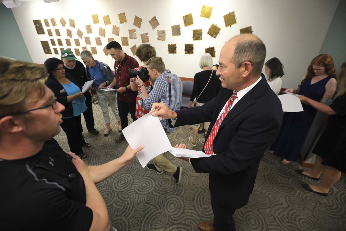 Clark County Auditor Greg Kimsey hands out initial returns on the night of the 2019 August primary election. Photo by Mike Schultz