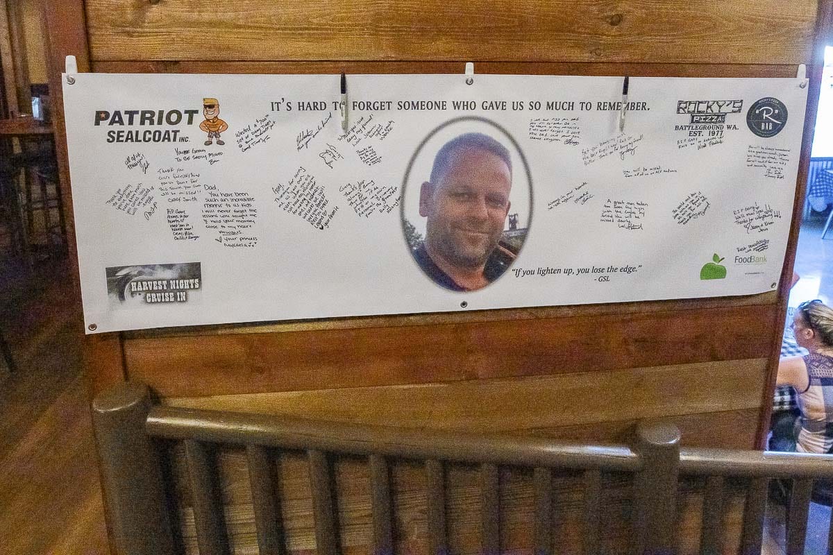 Folks were asked to sign a banner inside Rocky’s Pizza, sharing their thoughts on Gary Livingston. Photo by Mike Schultz