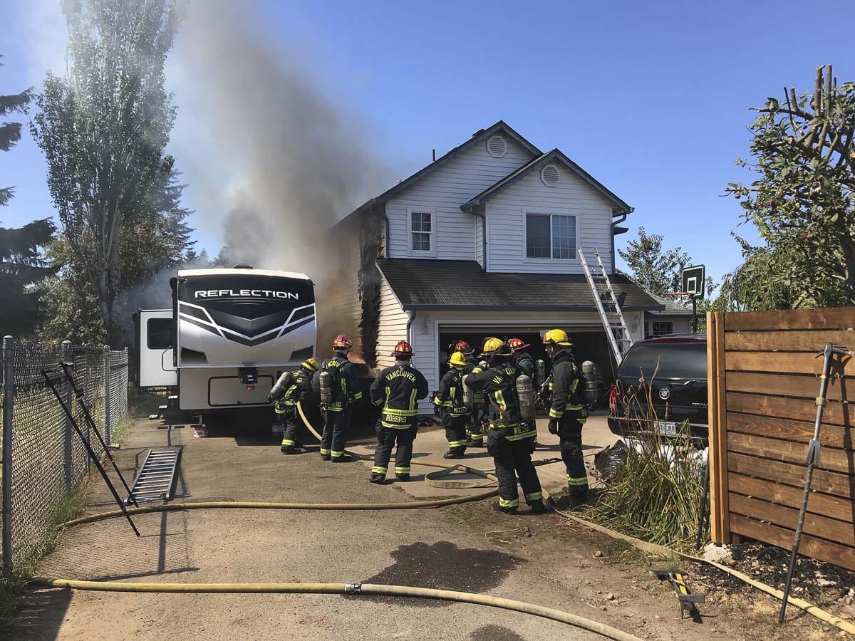 A car drove into a home in East Vancouver Wednesday, causing a fire to both the vehicle and the residence. Photo courtesy of Vancouver Fire Department