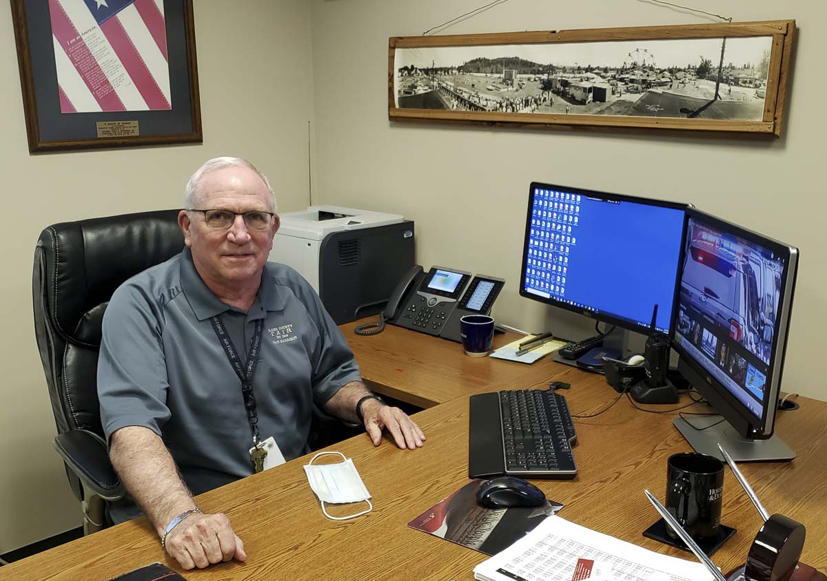 John Morrison Jr., the fair manager and CEO of the Clark County Fair, works at his desk this week. It is quiet at the fairgrounds this year, in what would have been the middle of the 2020 fair. Instead, Morrison and staff are looking forward to 2021. Photo by Paul Valencia