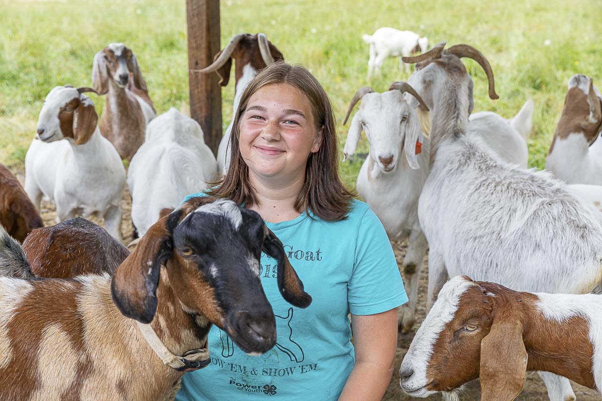 Mia Achziger joked that her dad has no idea how many goats she has on the family farm in La Center. She and her mom just keep adding a few every so often. Photo by Mike Schultz