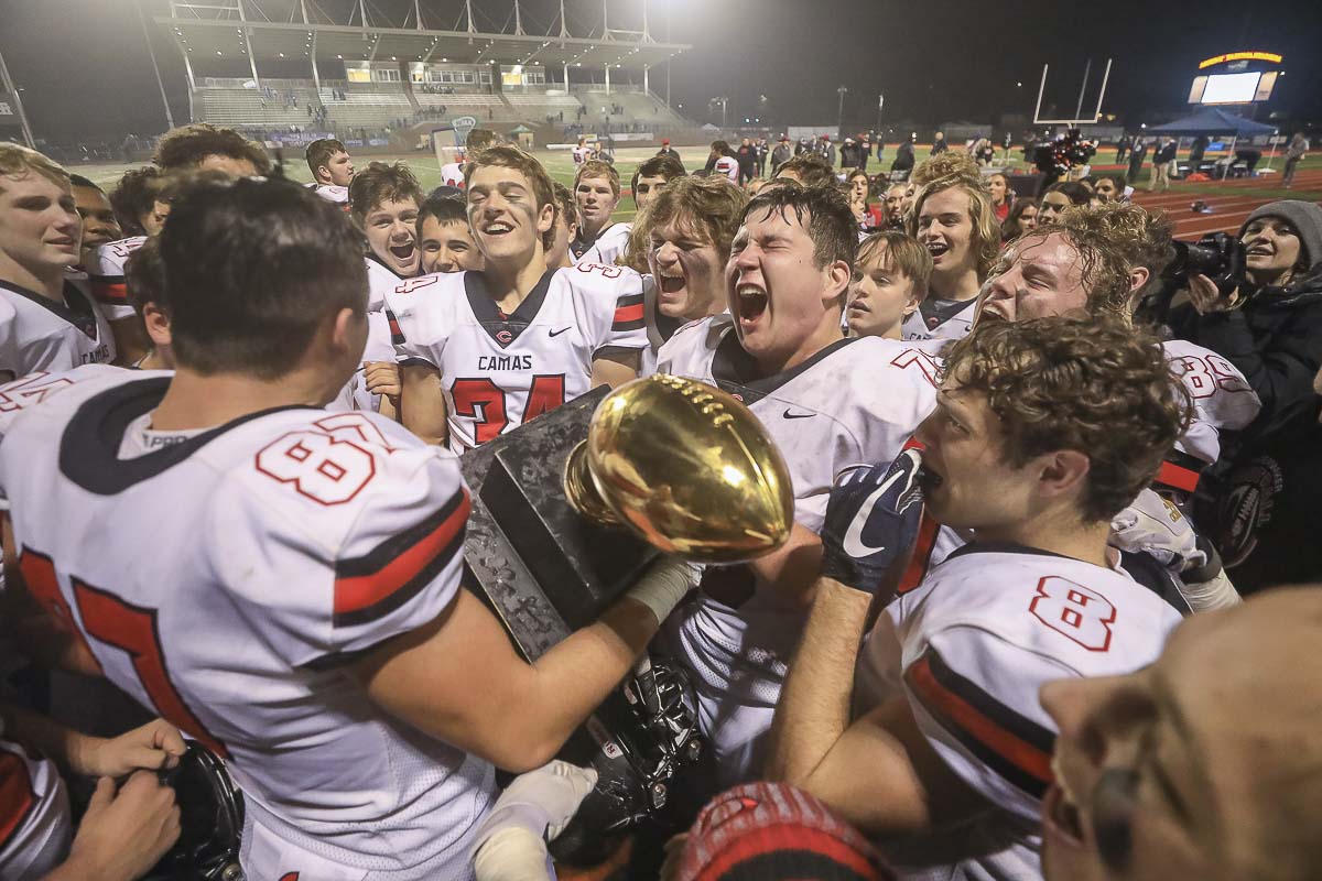 The Camas Papermakers celebrate after winning the 2019 Class 4A state football championship. Photo by Mike Schultz