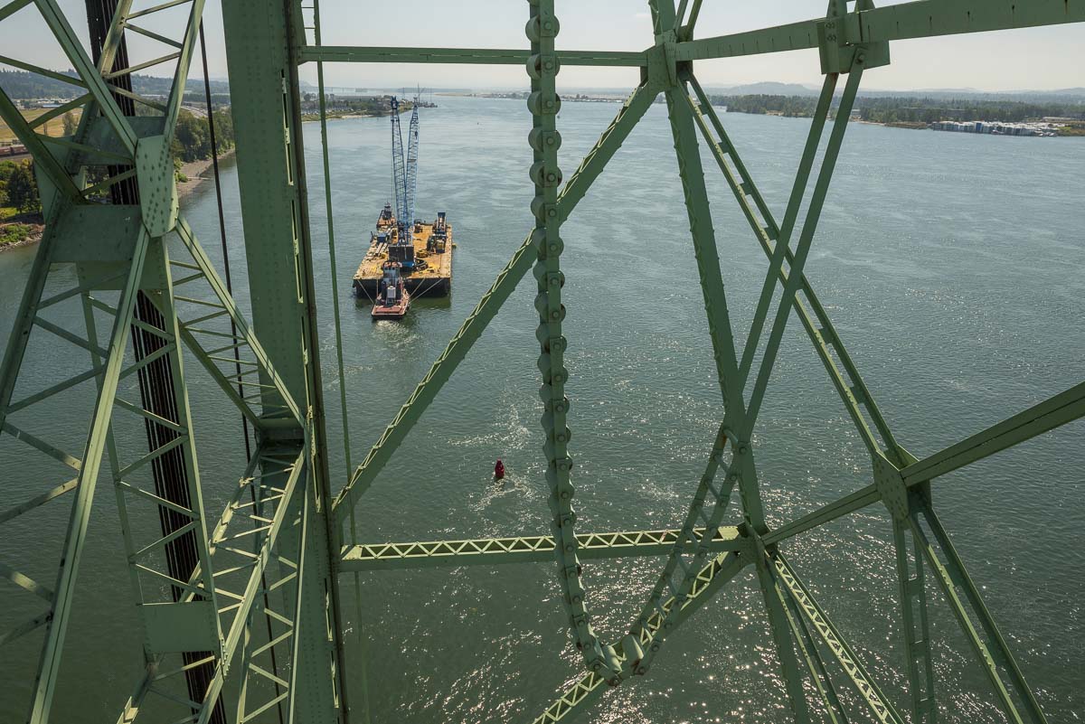 The crane barge carrying the trunnion components for the I-5 Bridge can bee seen here on the Columbia River. Photo courtesy of Oregon Dept. of Transportation