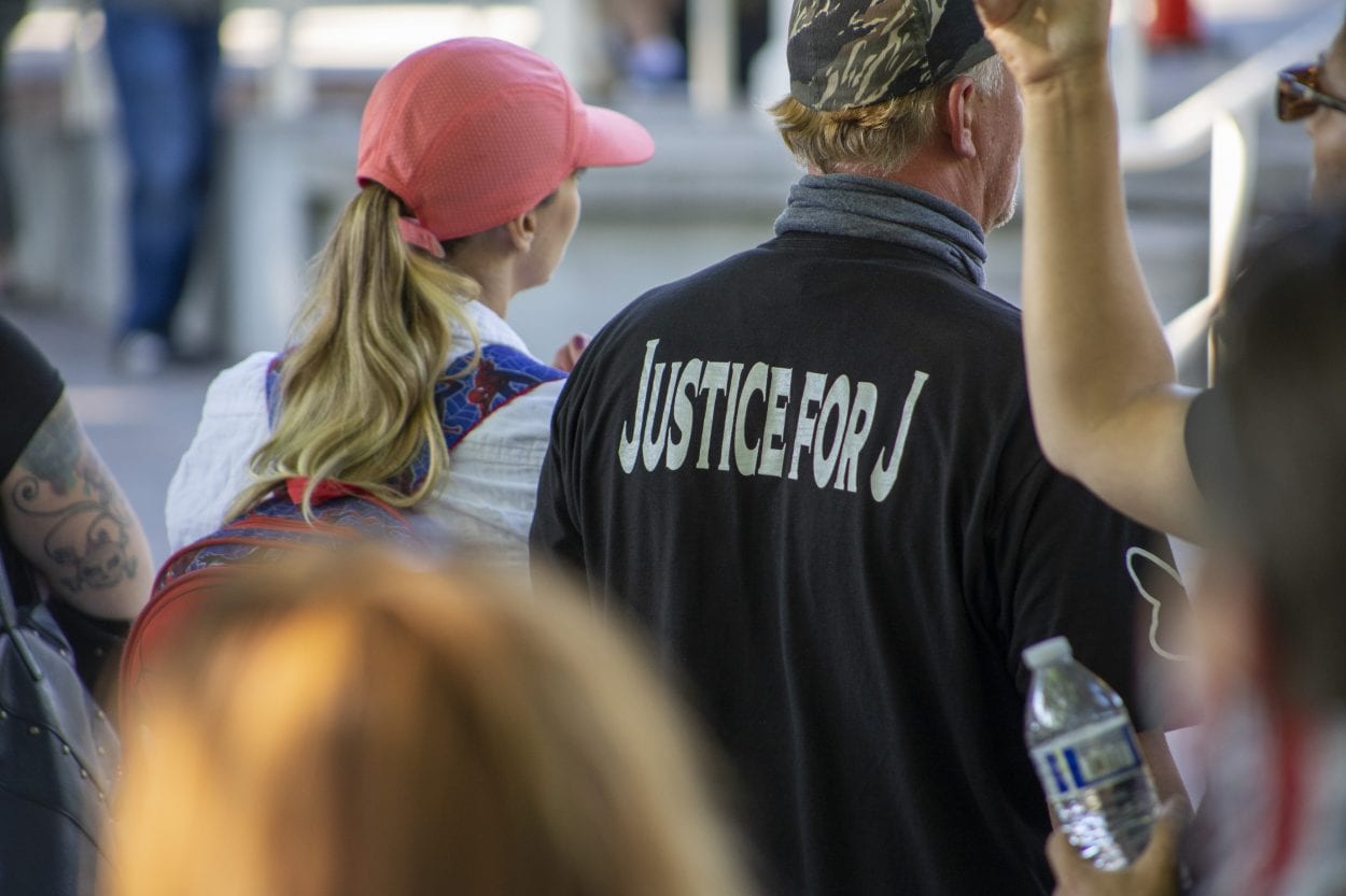 Many in the crowd wore “Justice for J” T-shirts, since Aaron Danielson was known by many as Jay. Photo by Jacob Granneman