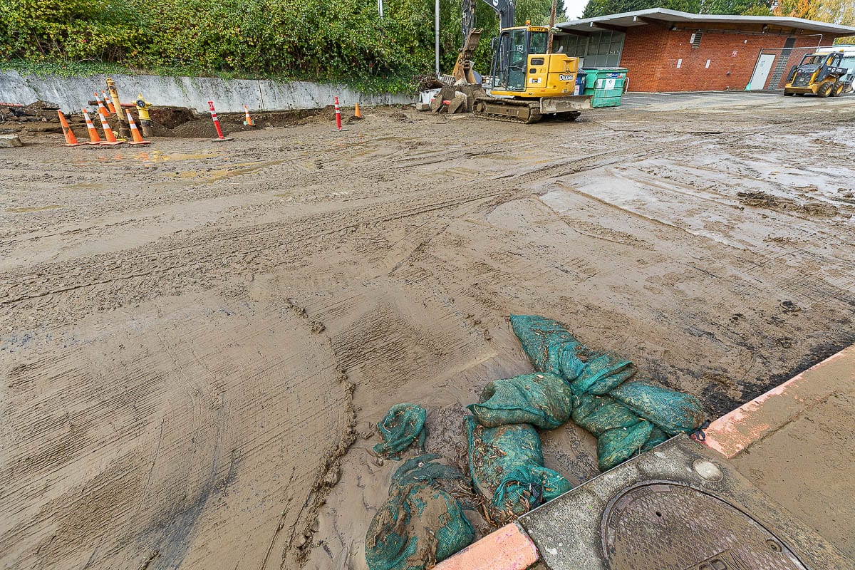 Sandbags were used to prevent water from a main break near Columbia River High School from getting into a nearby storm drain. Photo by Mike Schultz