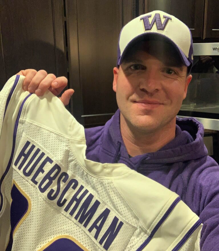 Ben Huebschman shows off his 2003 Washington Huskies jersey that was recently given to him by a fan who happened to have it all these years later. Photo courtesy Ben Huebschman