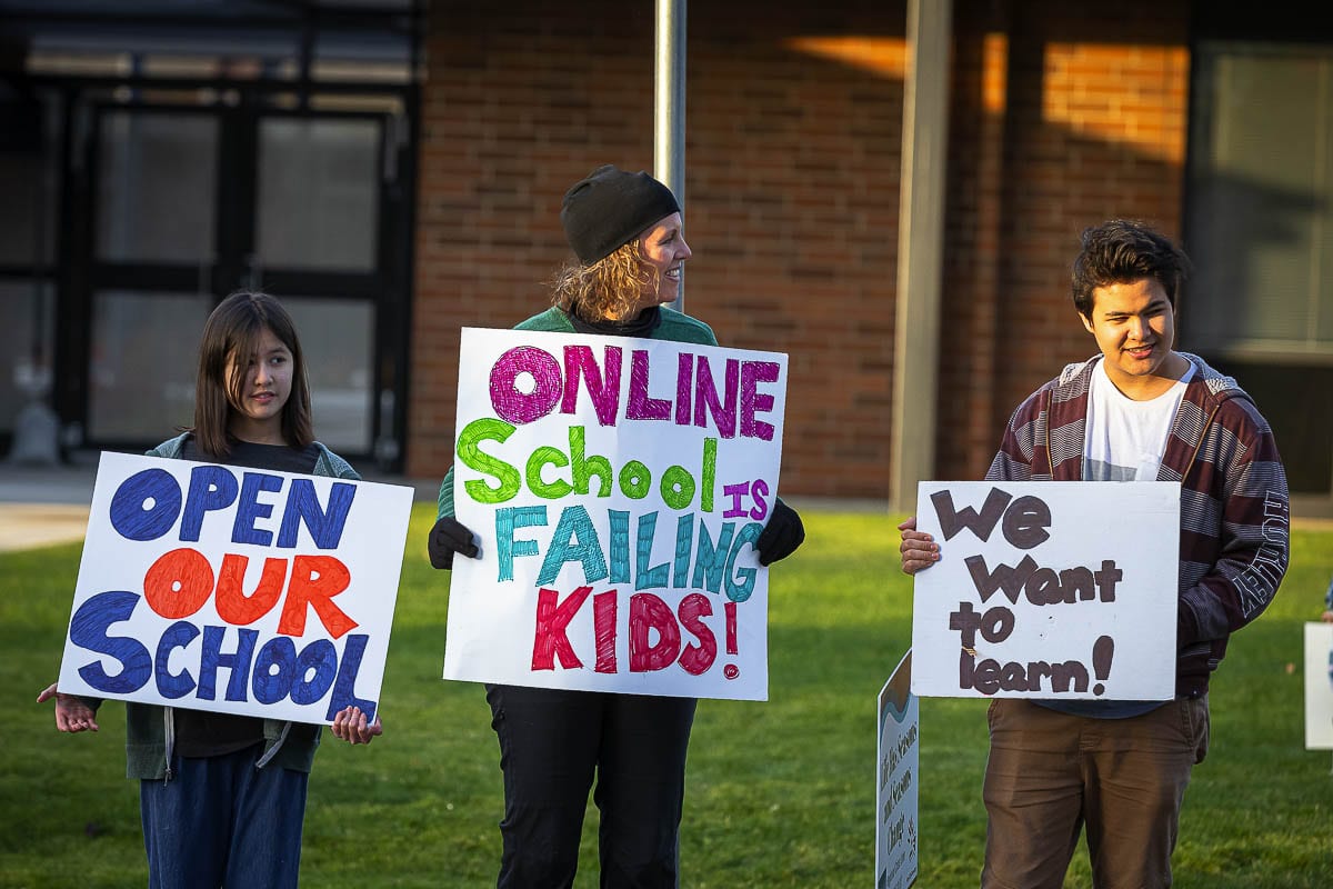Charly, Julie and Max Tong rally for Ridgefield schools to be opened. Online zoom classes are not working for them. Photo by Mike Schultz