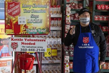 Clark County Today staff members ring the bell for Salvation Army