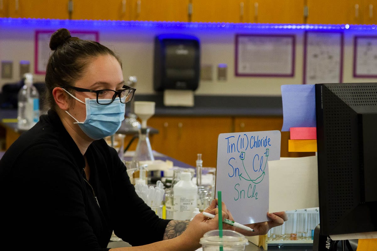 While students watch the experiment, they make observations, develop compound formulas, and use the lessons taught by Marshall to describe what reactions take place. Photo courtesy of Woodland School District