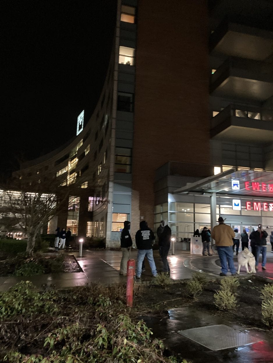 Protesters, some carrying weapons, tried to get into Legacy Salmon Creek Hospital Friday night after a woman said her mother was being held against her will. Photo by Jacob Granneman