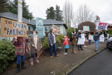 Emotions run high at small rally to open schools