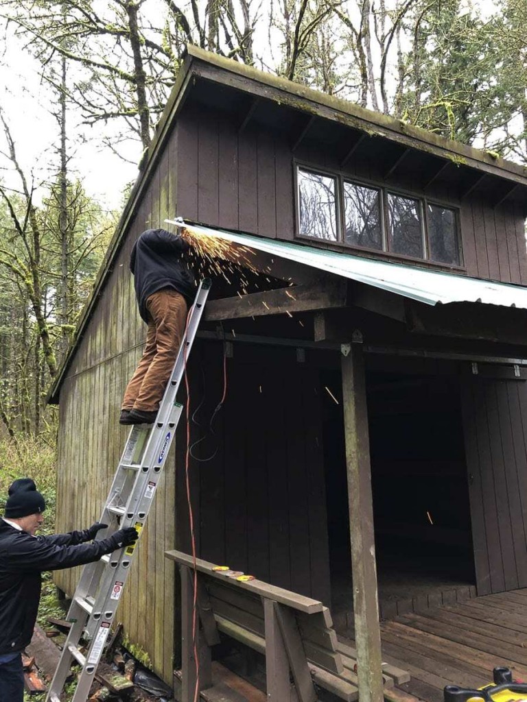 Camas Lions help restore wind and ice damaged structure at Camp Currie