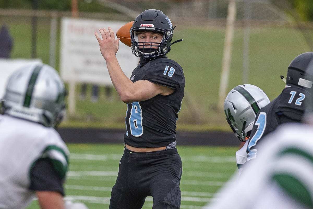 Jarod Oldham, a sophomore, shown here earlier in the season, looked poised Saturday while leading the Hockinson Hawks on a 95-yard drive to secure the victory over Columbia River. Photo by Mike Schultz