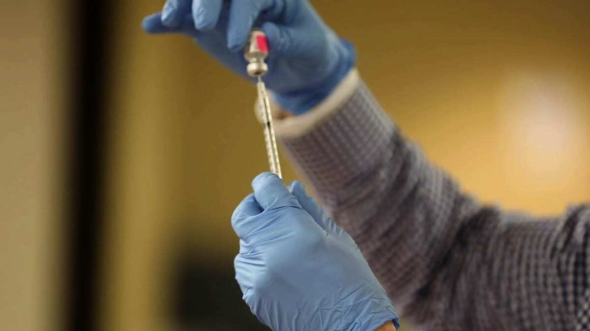 A Pfizer vaccine dose is taken from a vial at PeaceHealth Southwest Medical Center. Photo courtesy PeaceHealth Southwest