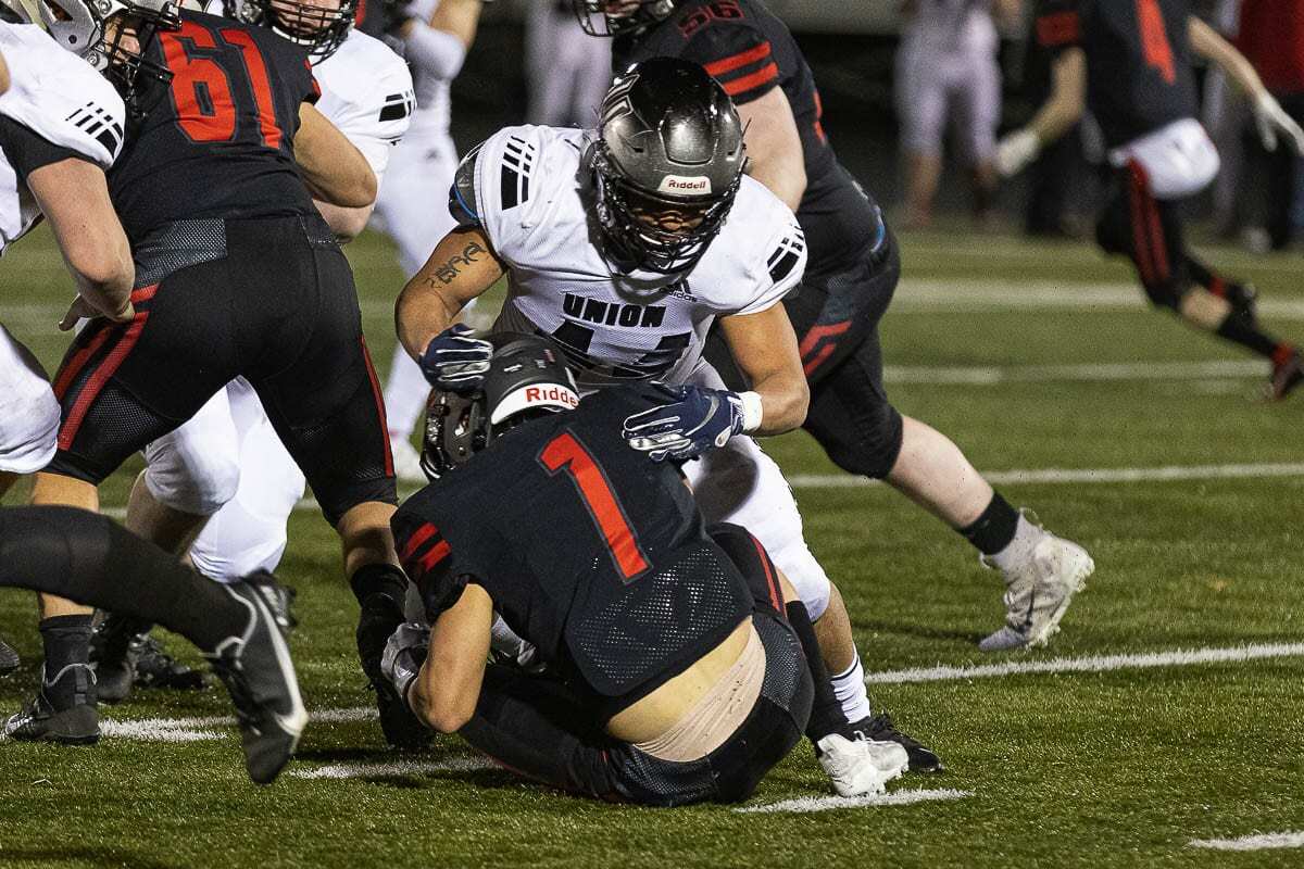 Union linebacker Therman Bibens, shown here earlier in the game, had the fourth-down stop to end Camas’ comeback bid. He also forced two fumbles in Union’s win. Photo by Mike Schultz