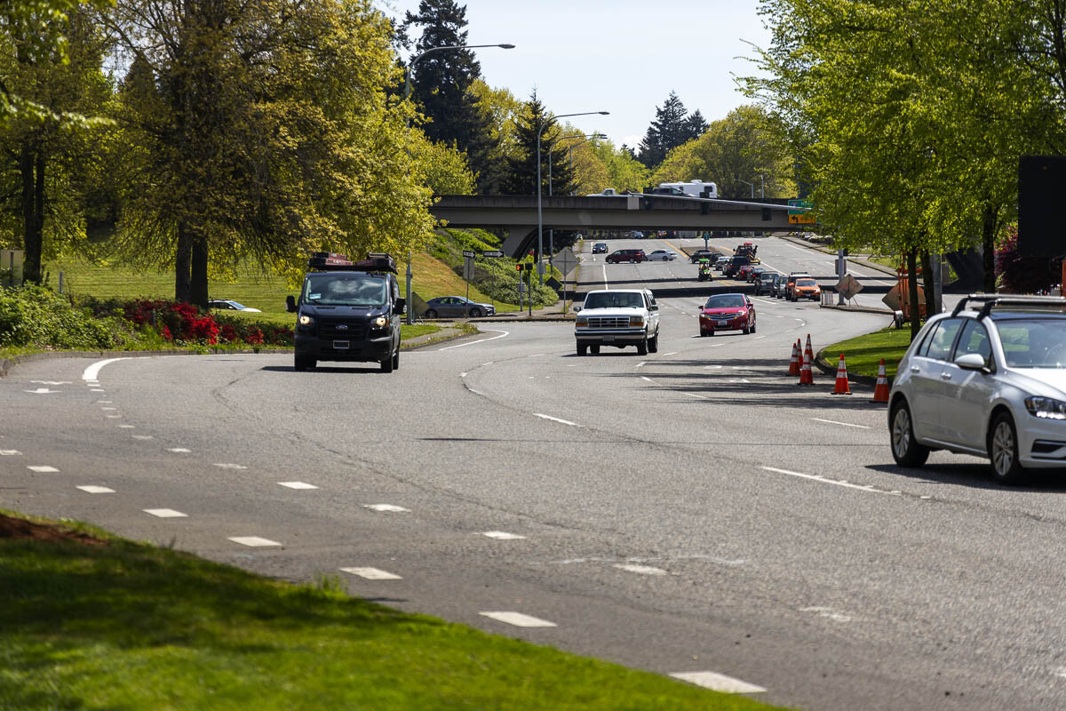 To provide improved protection for people riding bikes from people driving cars, bike lanes will move to the curb-side of the parking lanes. Photo by Jacob Granneman