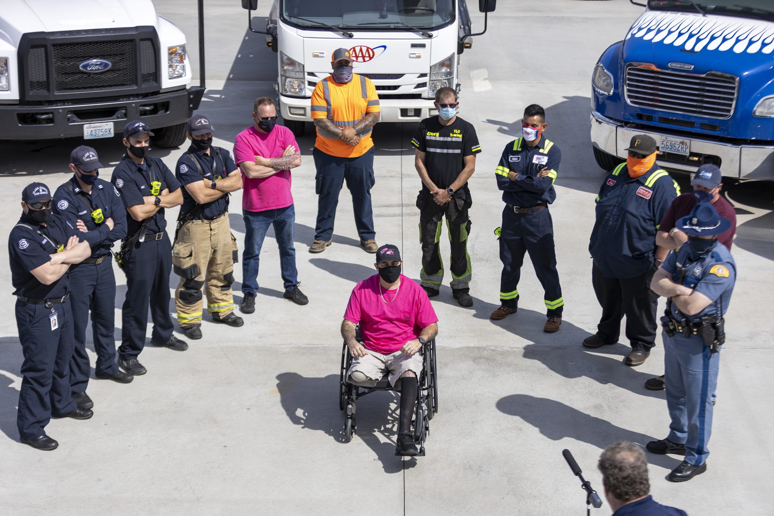  Chappelle’s Towing driver David Rios (center) lost his leg in an accident in January. He joined the group of first responders to create a PSA telling folks to “Slow Down, and Move Over.” Photo by Jacob Granneman