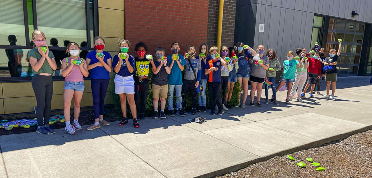 South Ridge Elementary School teacher Karen Moses’ fourth grade students proudly show their hand painted rocks. Photo courtesy of Ridgefield School District