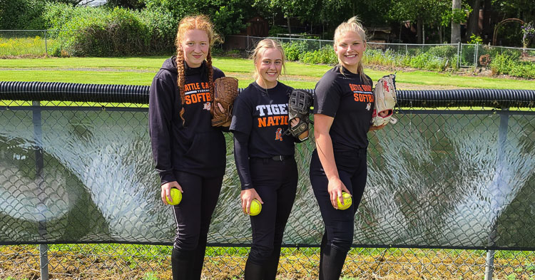All eyes on Mallory Meyer, Rylee Rehbein, and Cady Gruenberg, who have been slinging it and swinging it for Battle Ground softball. The three pitching aces also are known for their hitting abilities with the Tigers. Photo by Paul Valencia