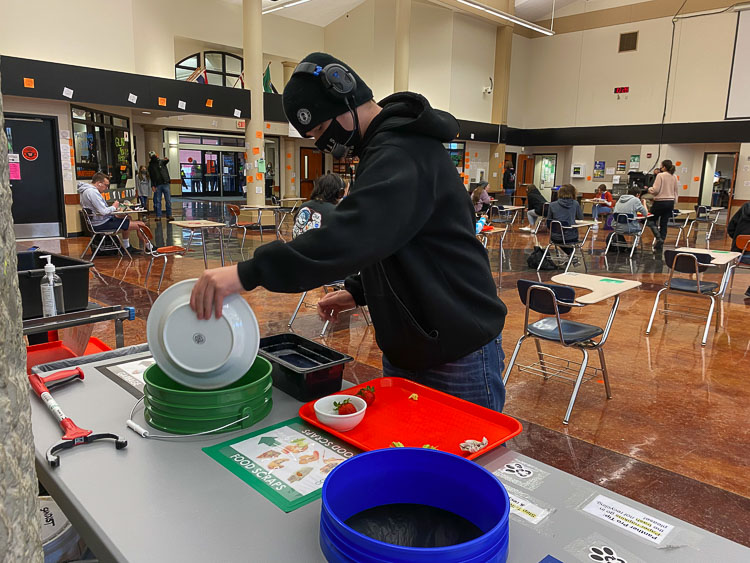 Washougal High School freshman Blake Early sorts his meal waste after eating lunch. Photo courtesy of Washougal School District