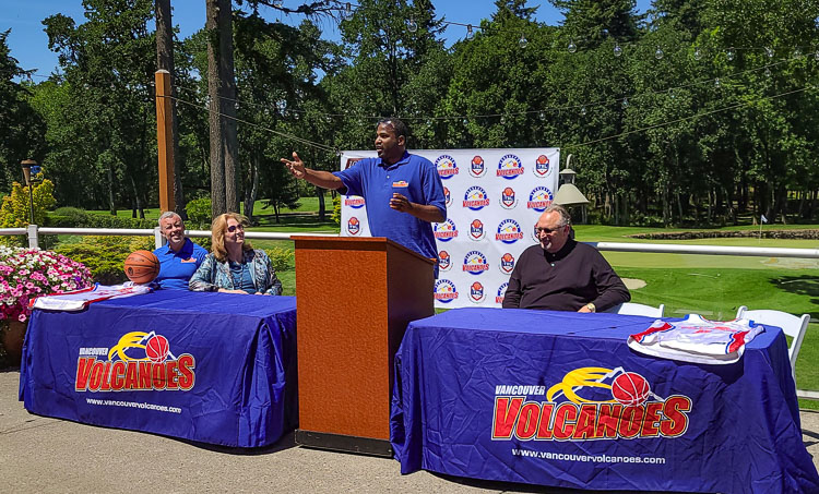 Curtis Hill, the team market owner for the Vancouver Volcanoes, discusses his history with the team at a press conference welcoming back the Volcanoes to Clark County. Anne McEnerny-Ogle, the mayor of Vancouver, was at the event, as well, along with Volcanoes coach Jeff Perrault, left, and Dave Magley, the president of The Basketball League. Photo by Paul Valencia
